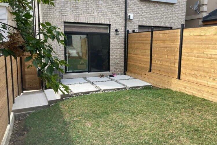 Concrete slab patio and slip fence on aluminum posts in Caledonia